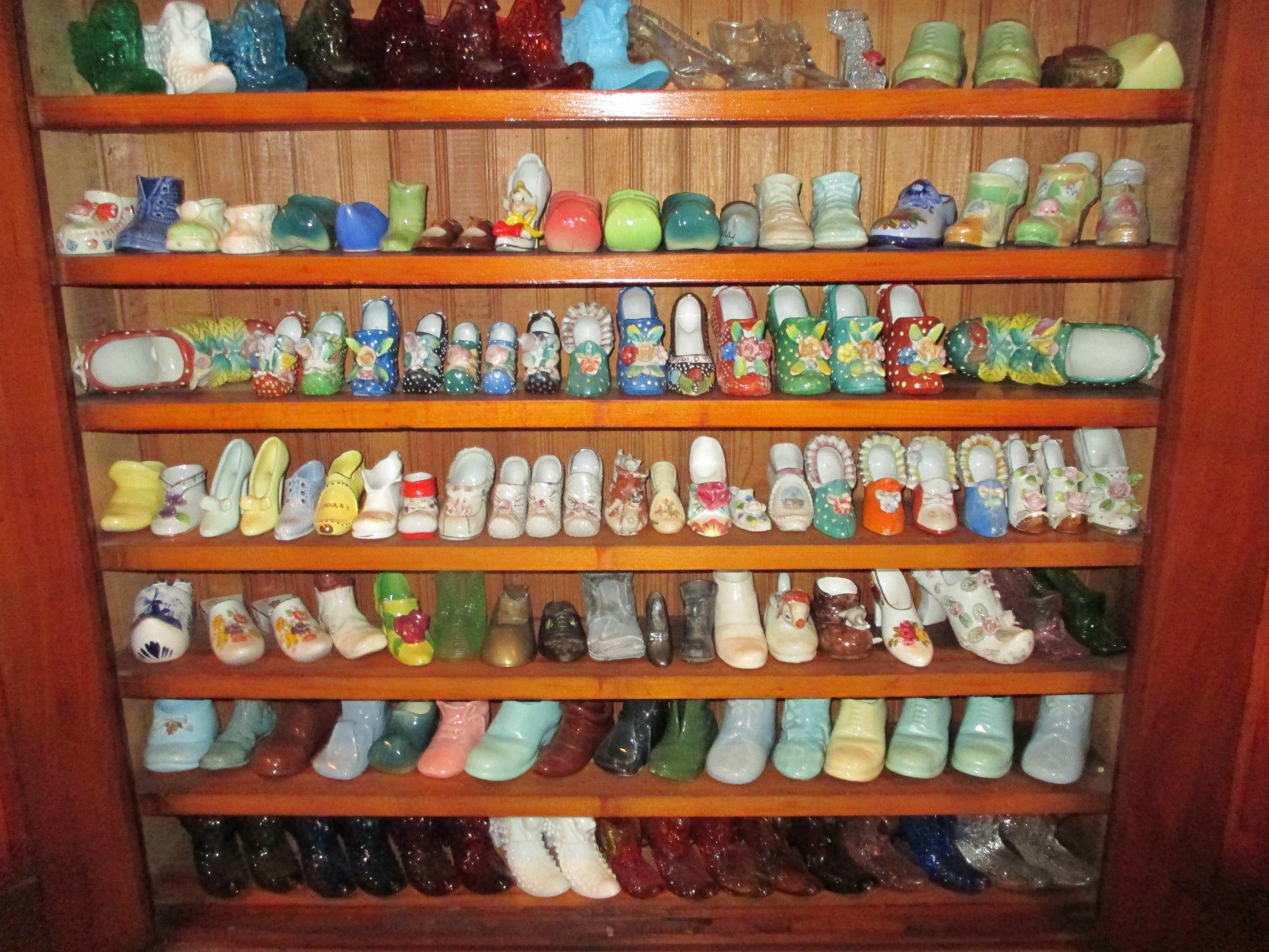 COLLECTION OF 178 GLASS AND CERAMIC SHOES PLUS ANTIQUE CABINET