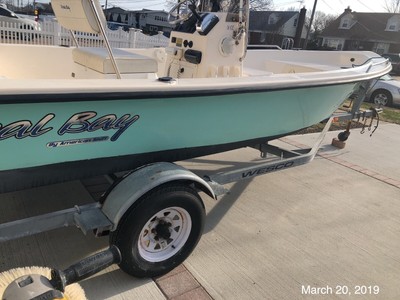 Seafoam Green 18 Coral Bay Center console fishing boat 90 hp Mercury trailer