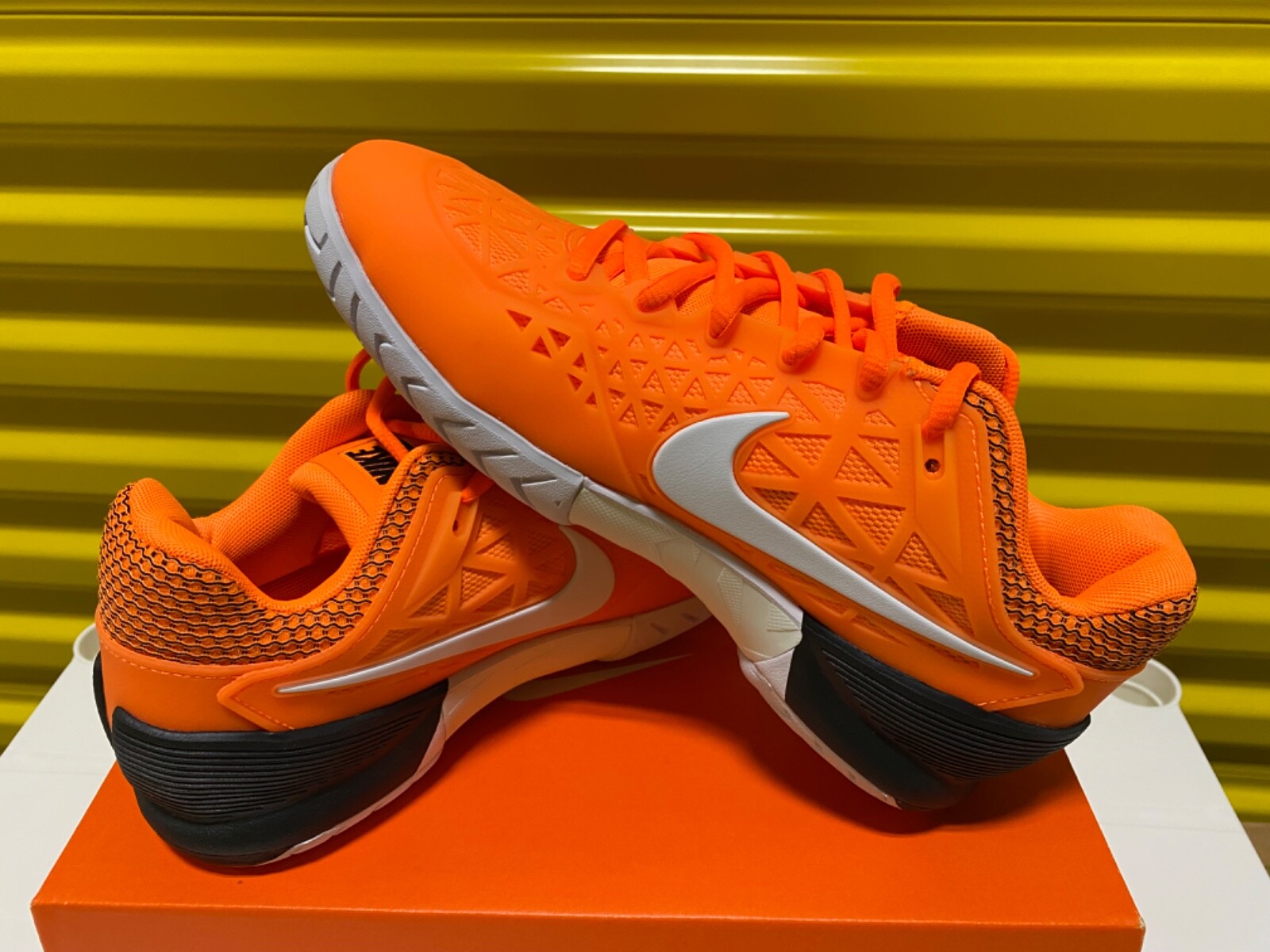 nike zoom cage 2 orange