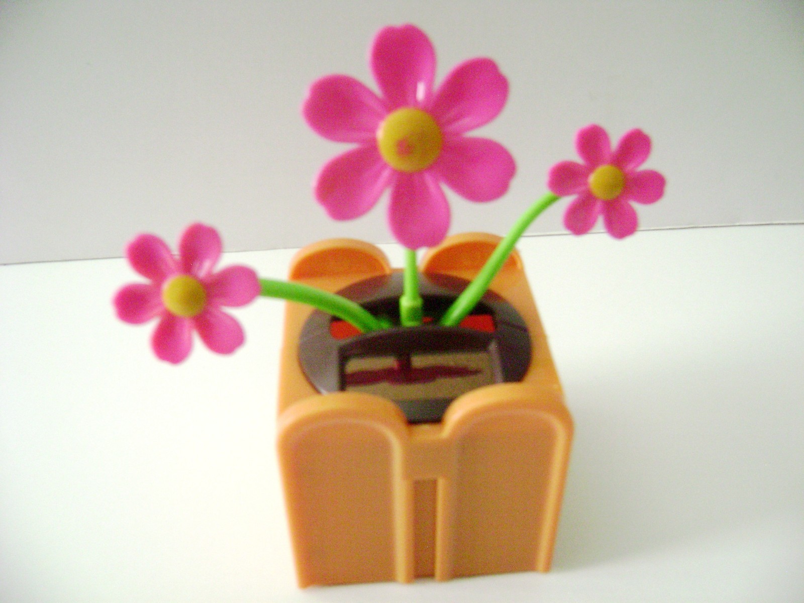 Solar Powered Dancing Red Daisy Flower Flip Flap Plant  (Burnt-Orange) Pot