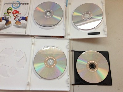 4pc. Lot Nintendo Wii Mariokart, Punch Out, Wii Sports Resort, etc.. Games