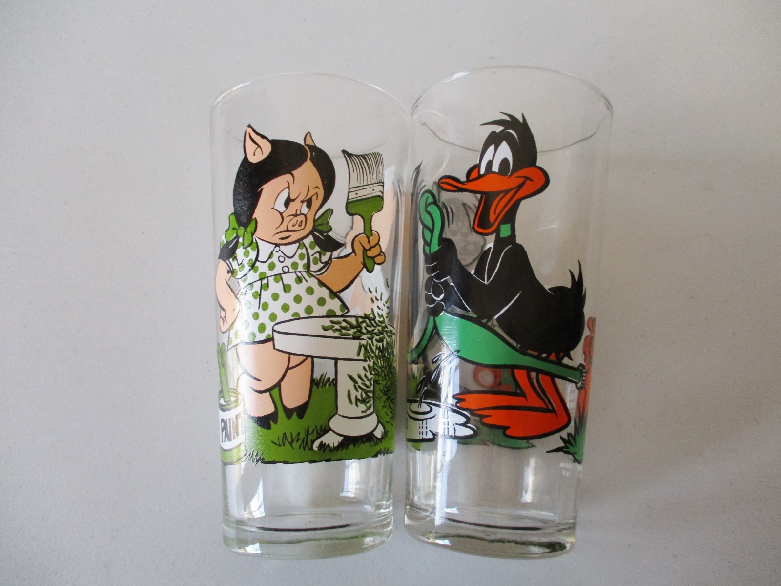 2-1976 Pepsi Warner Bros Glasses-Porky Pig w/Petunia & Pepe w/Daffy Duck Thick