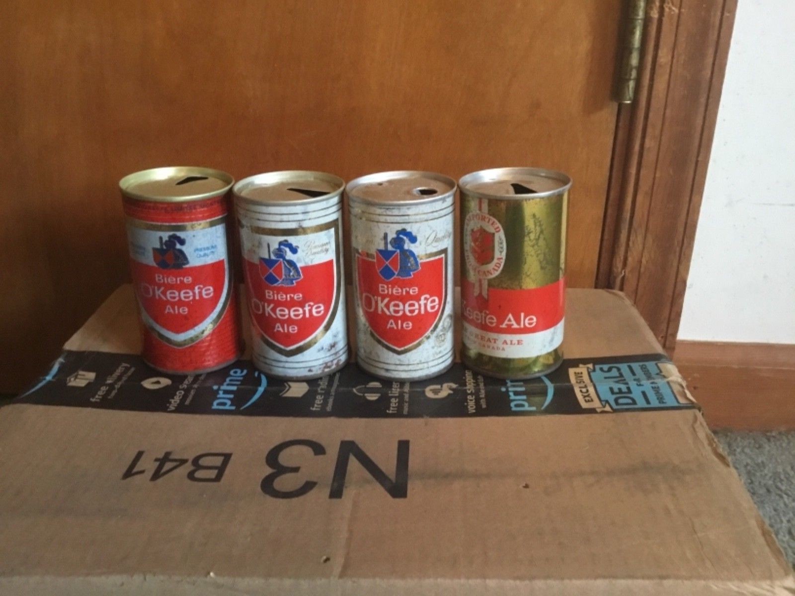 Four old O’Keefe ale cans