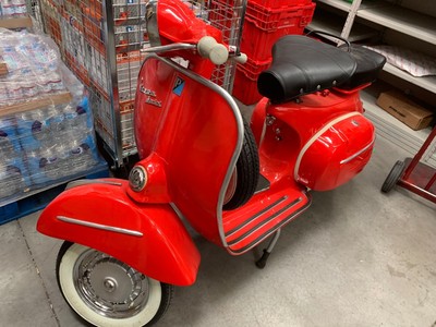 vespa scooters mopeds with side cart..
