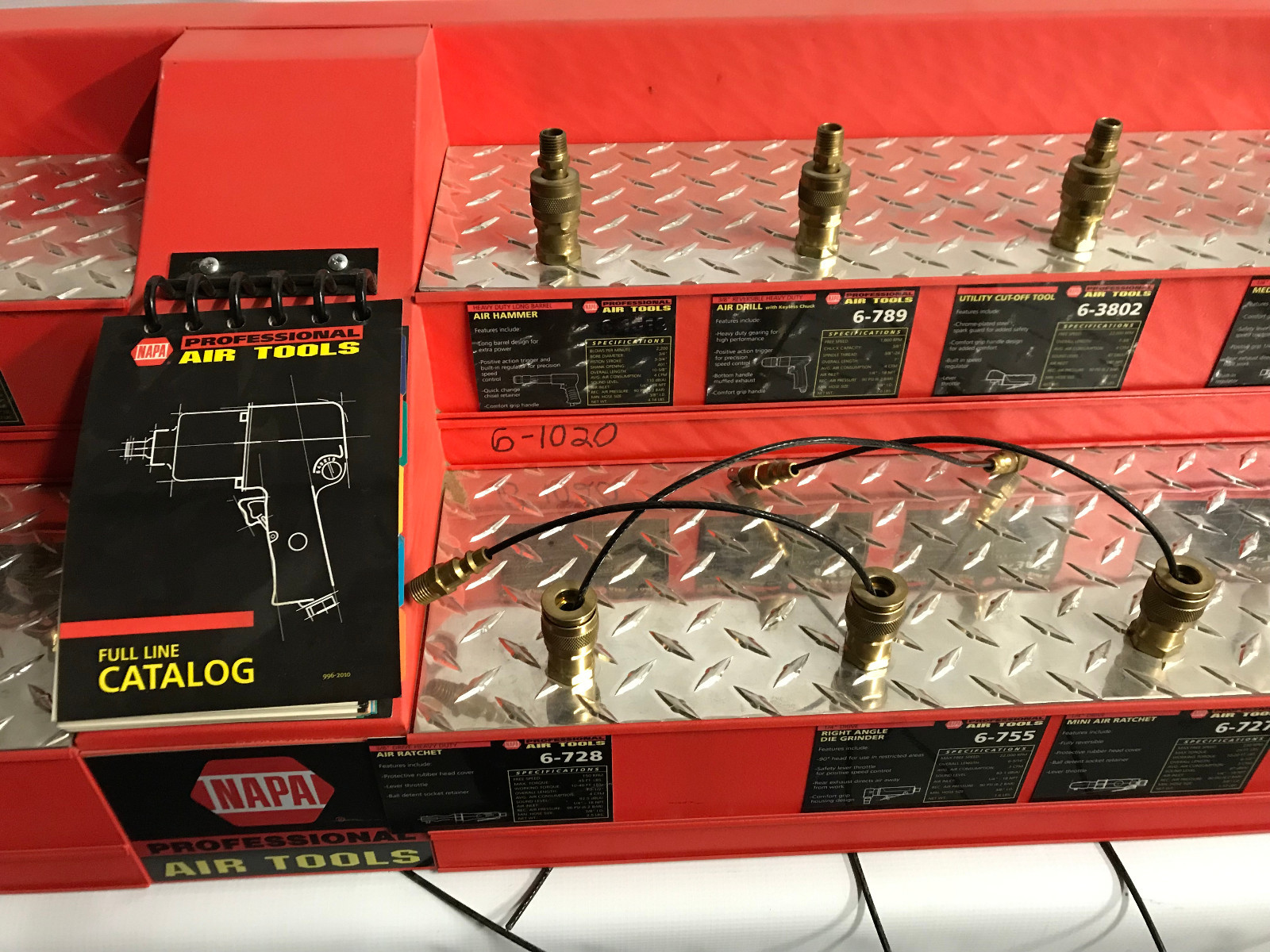 NAPA red air tool security display rack with security cables attached