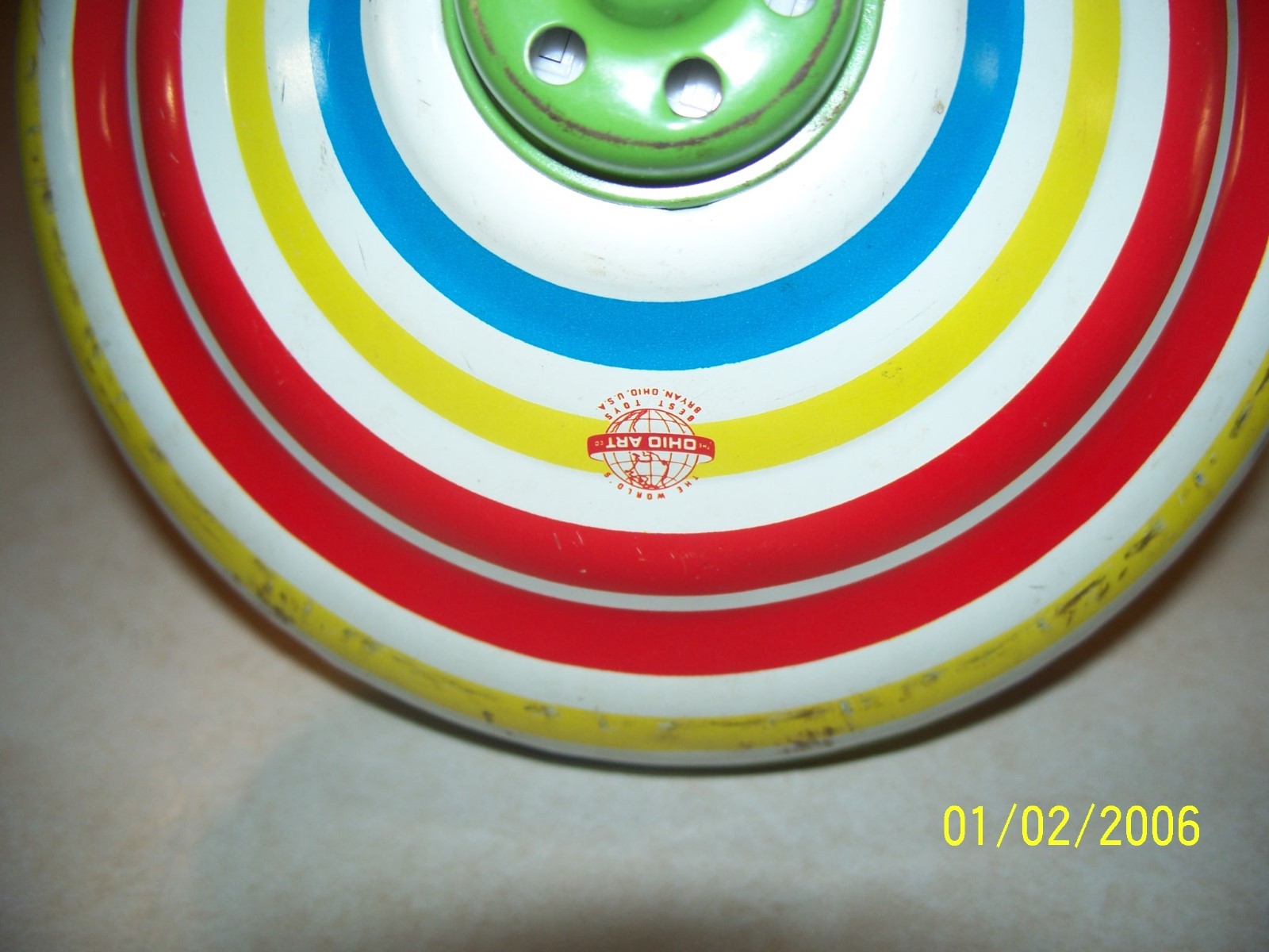 Vintage Ohio Art Co. -- Tin Spinning Top  here we go round the mulberry bush