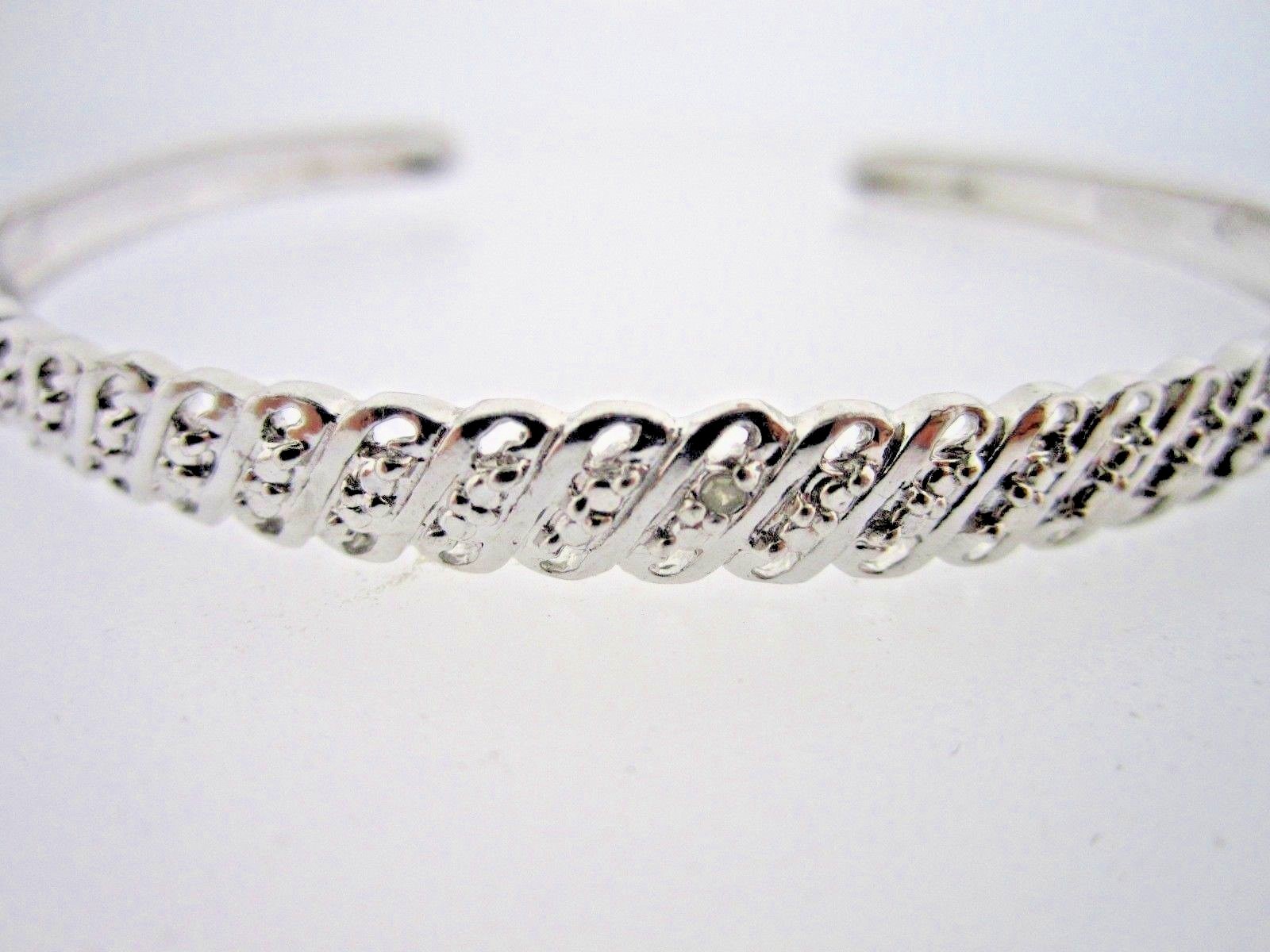 * .925 STERLING SILVER BANGLE  WITH 1 POINT DIAMOND AND LOOK OF DIAS THROUGHOUT