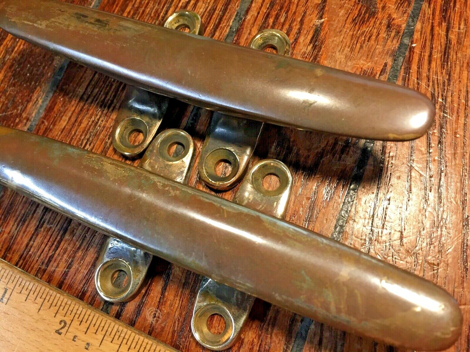 PAIR OF VINTAGE SOLID BRONZE CLEATS 6