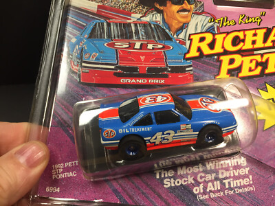 TYCO PETTY STP Stocker Bl/Or #43  BRAND NEW on cut card Never removed  MINTY!!!!