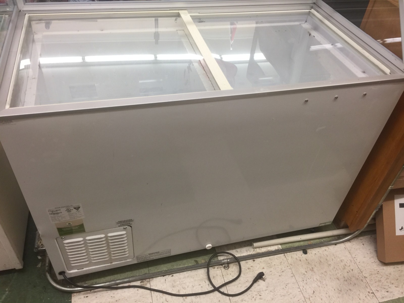 Ice Cream Machine, holds 8-1 gallon tubs, has sneeze guard and sliding glass