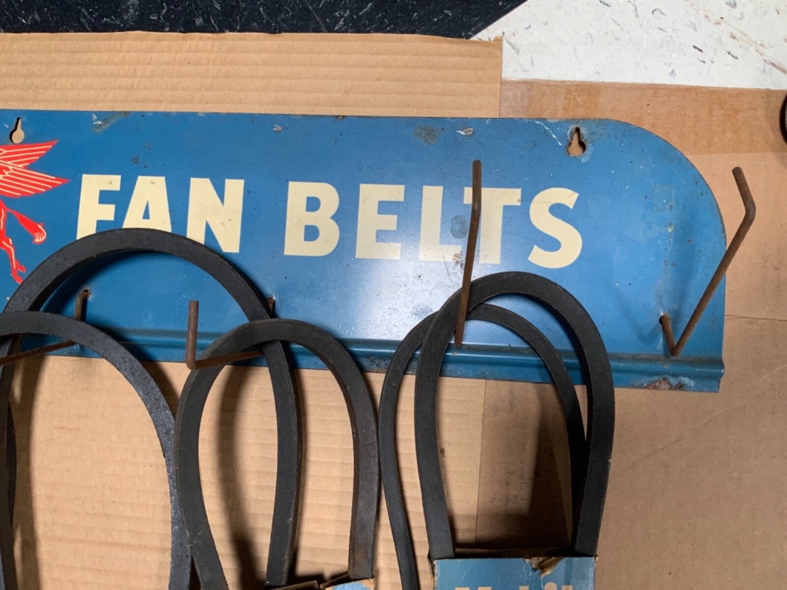Original Mobil Fan Belt Display Rack with original belts and packaging
