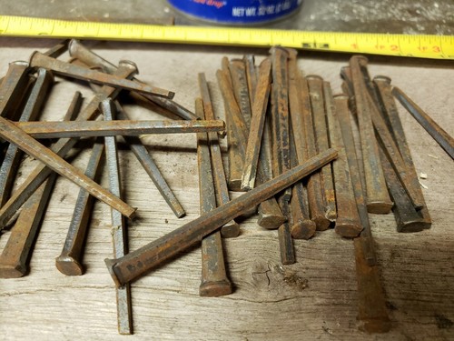 63 Antique 3 1/2 inch, square cut nails hand made unused, straight but rusty.