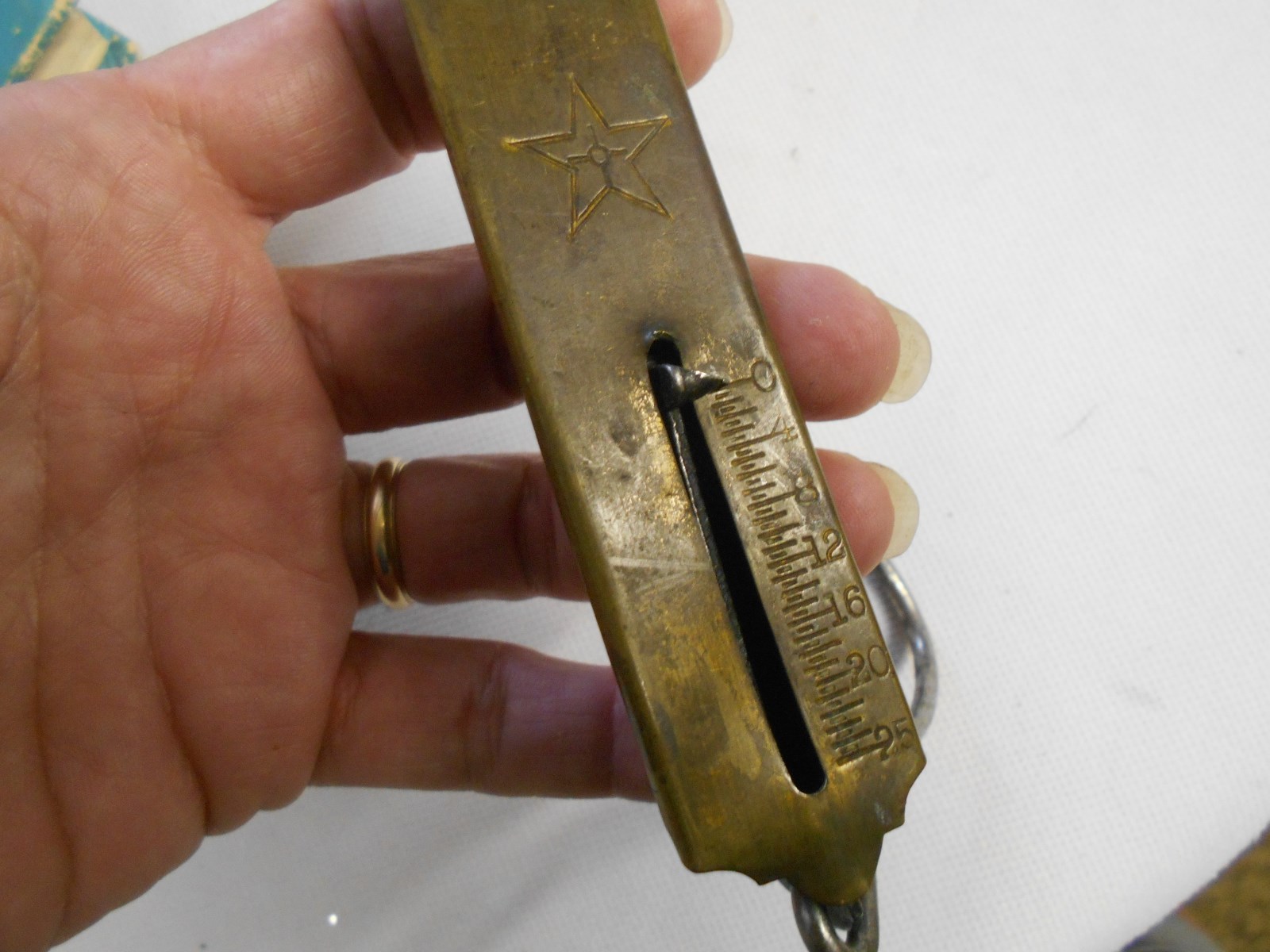 vintage brass 25 pound weigh scale with hook pull down hanging