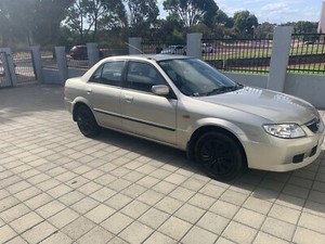 Мазда 323 2004