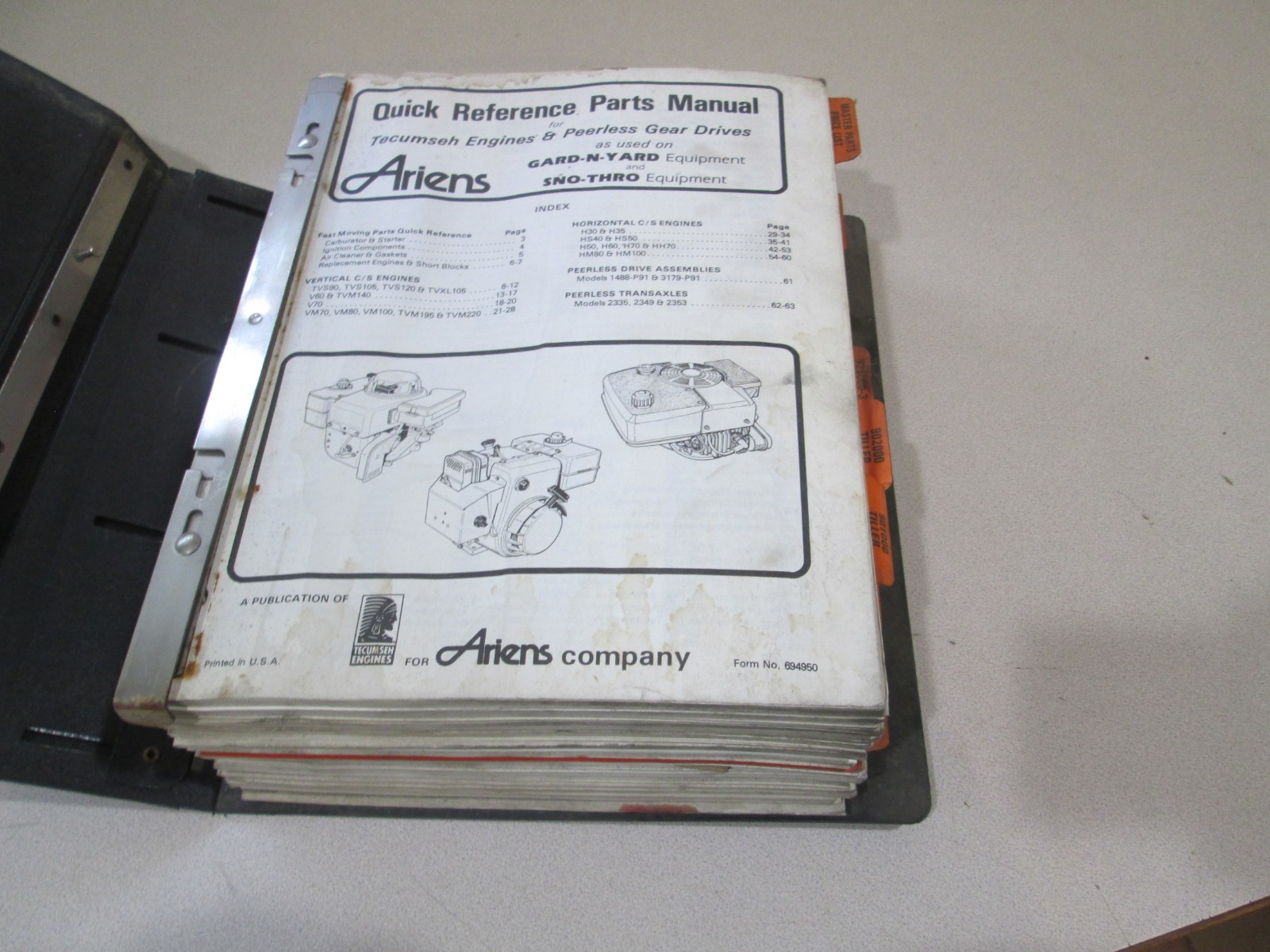 Binder full of Ariens Parts Manuals