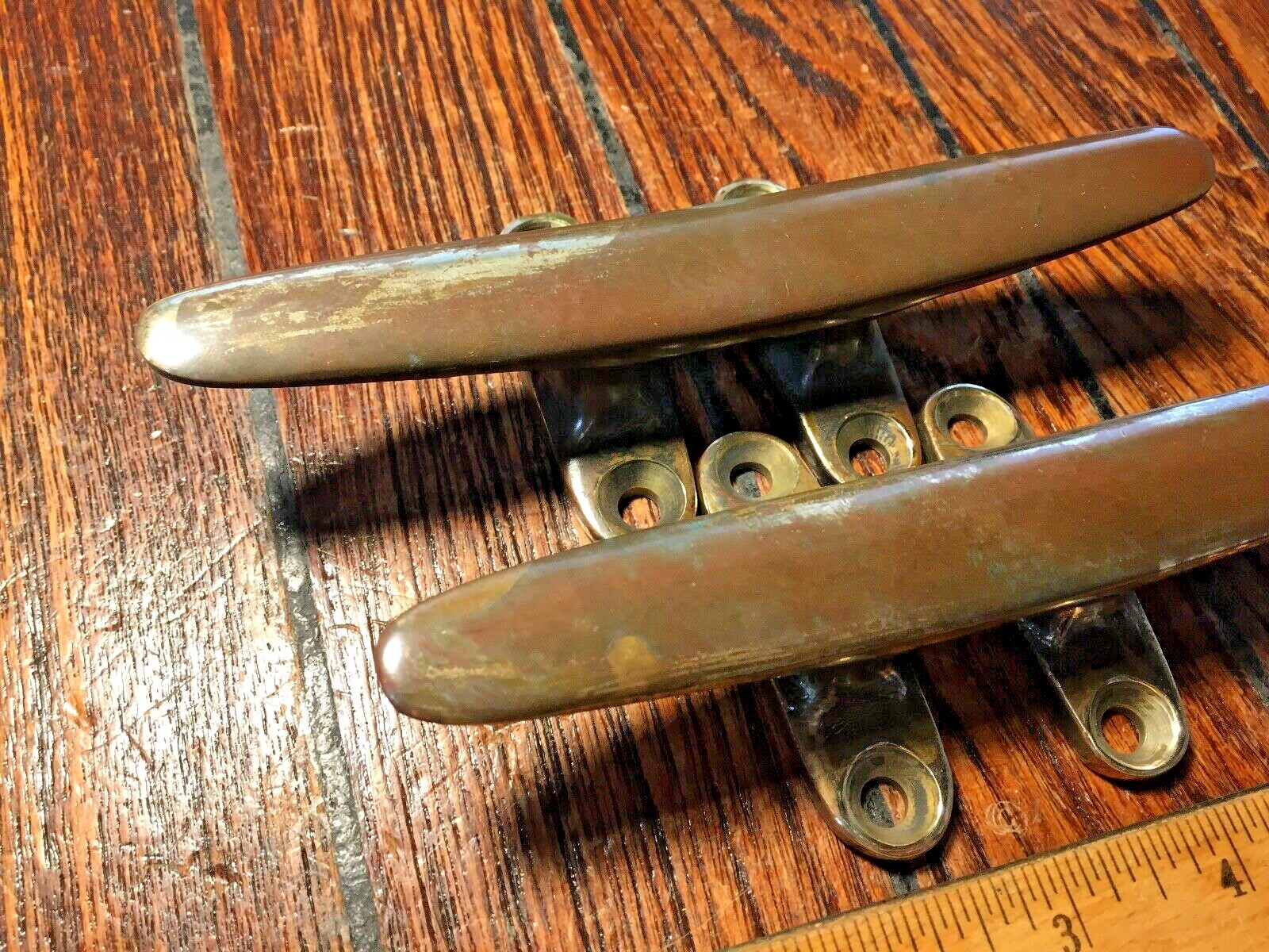 PAIR OF VINTAGE SOLID BRONZE CLEATS 6