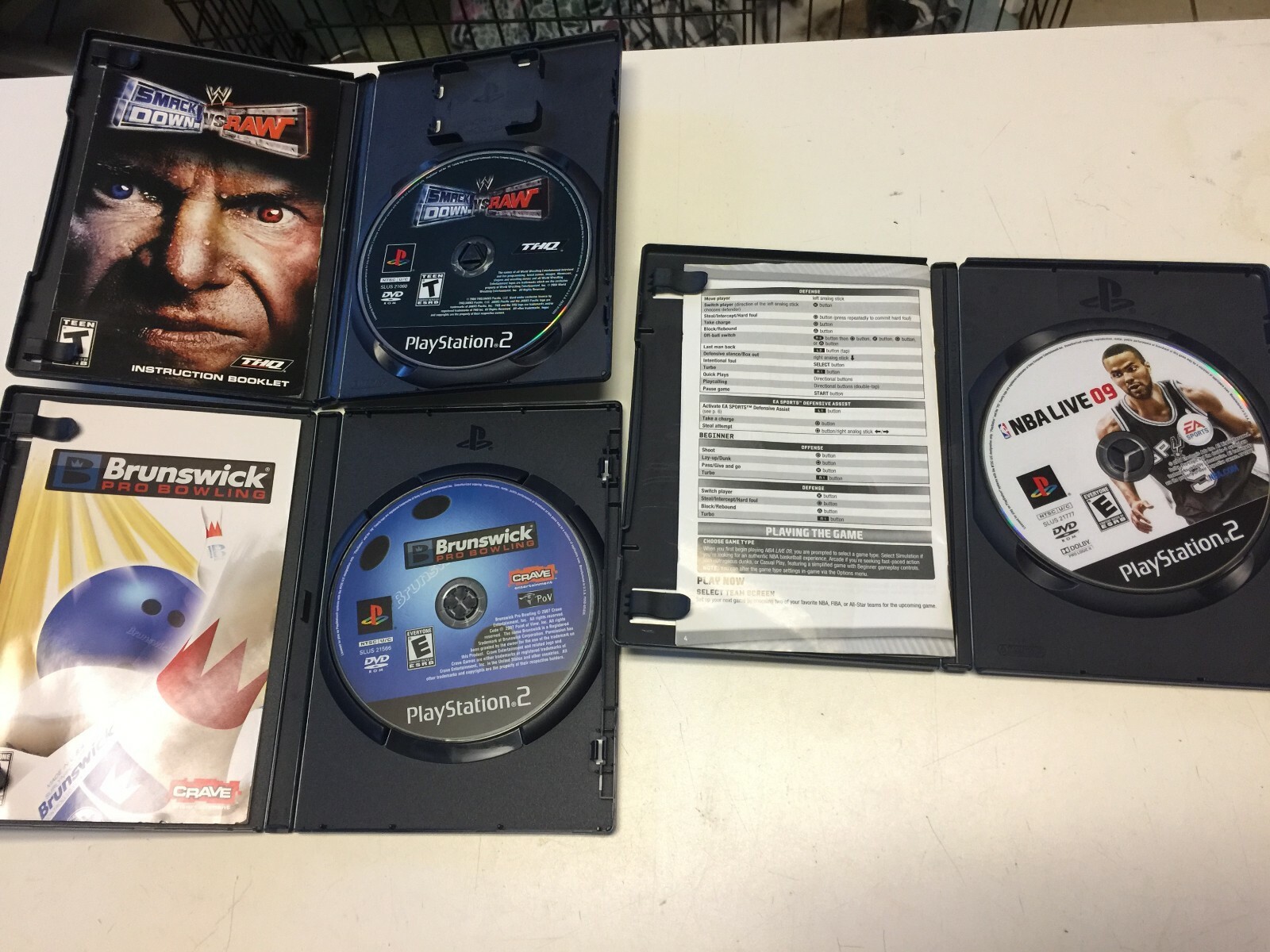 playstation 2  smackdown vs raw NBA live 09 Brunswick pro bowling lot of 3 games