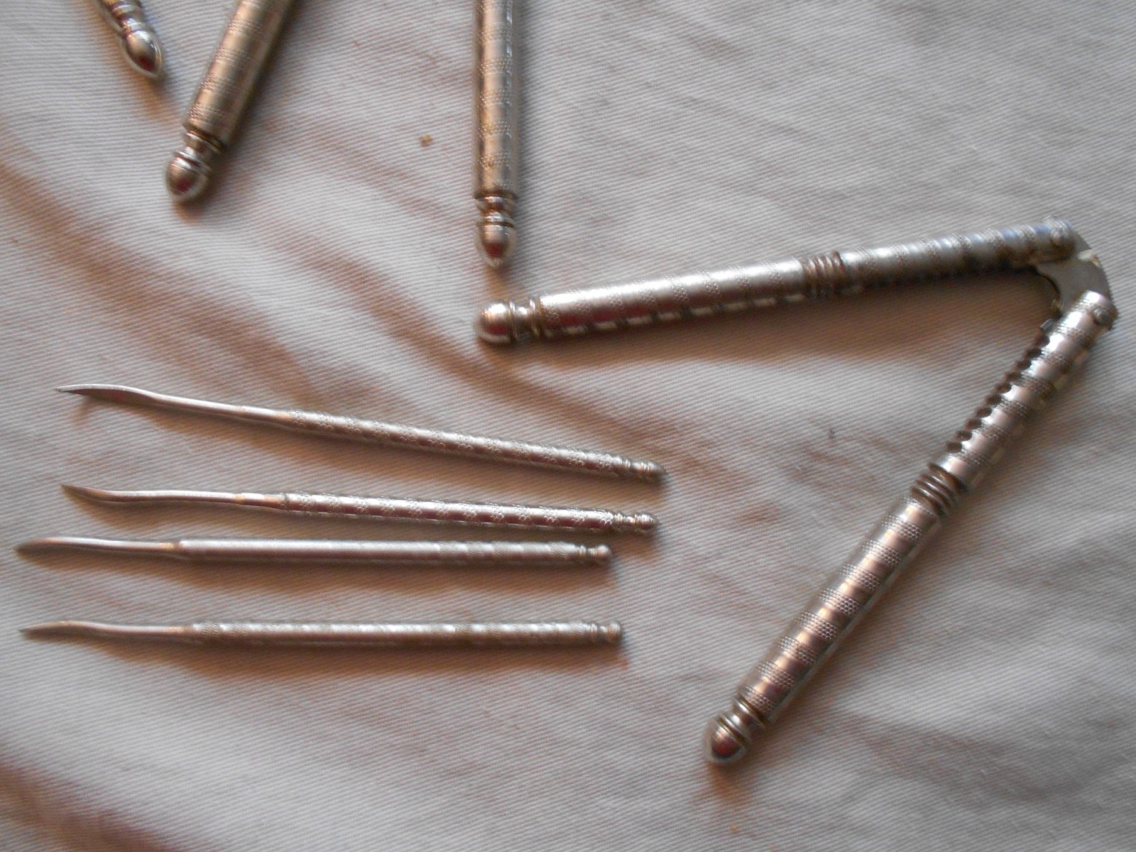 5 vintage steel HMQ nut crackers and 4 picks