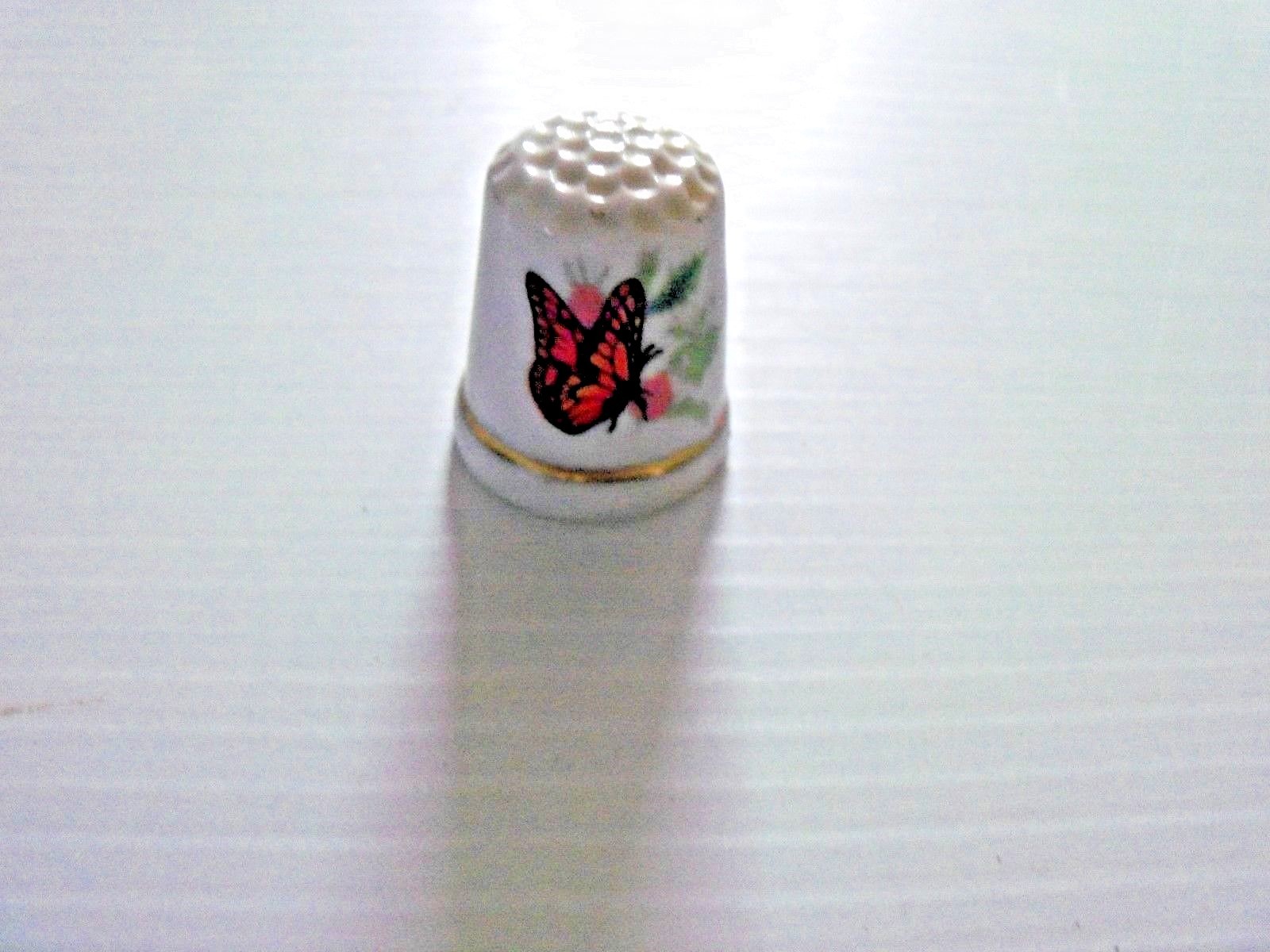 Lot of 7 Porcelain Thimble with Butterfly Pictured On It