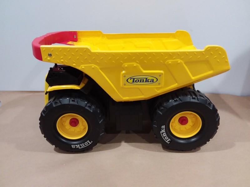 yellow metal tonka dump truck