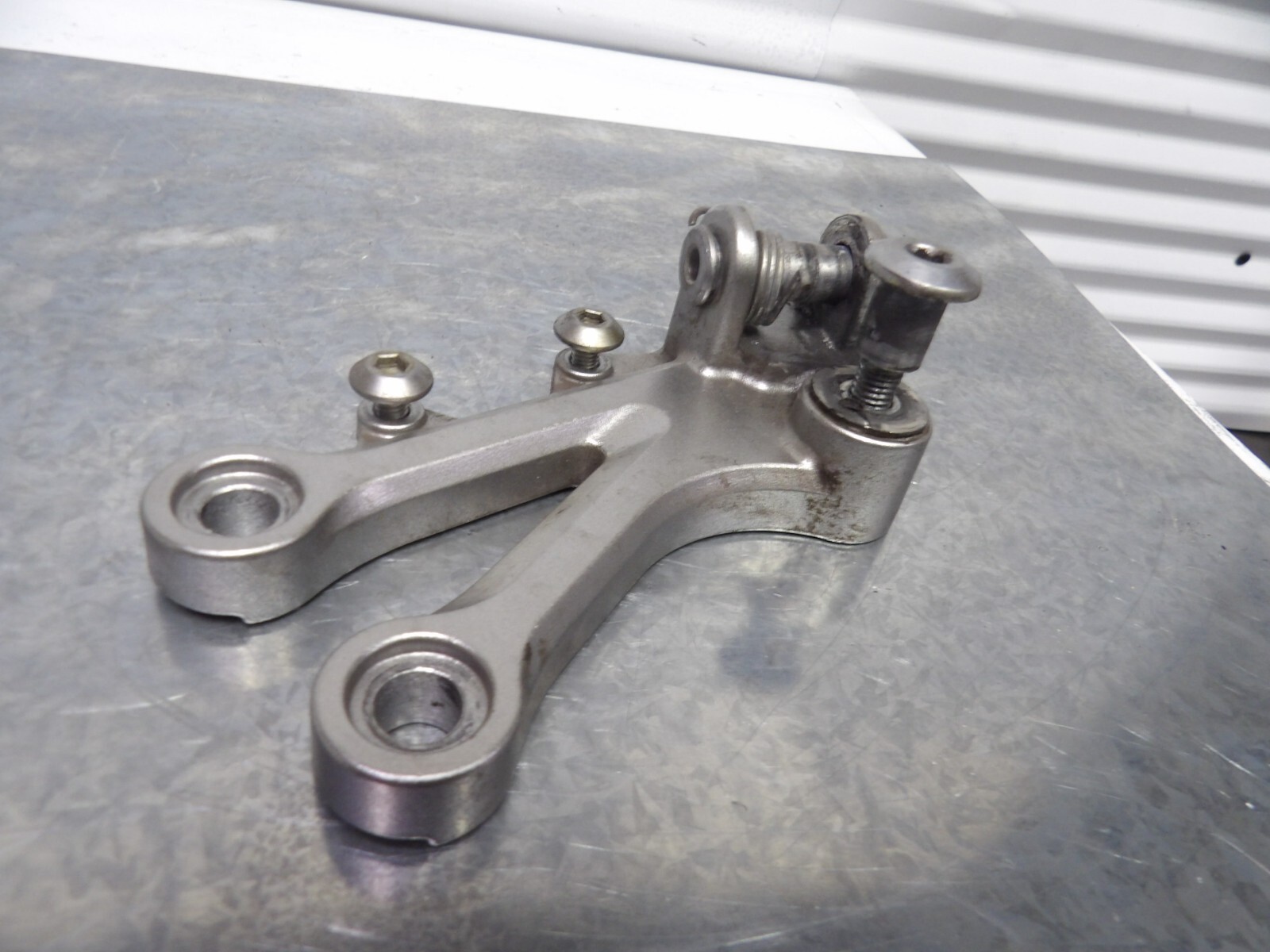 04-05 Kawasaki Ninja ZX10R front left foot peg rest w bracket 35063-0051 04-05 Kawasaki Ninja ZX10R front left foot peg rest w bracket 35063-0051