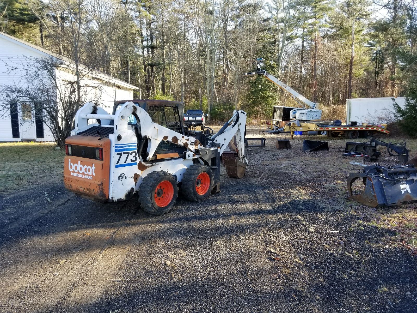 773 BOBCAT PACKAGE (INCLUDING MISC. ATTACHMENTS + TRAILER)