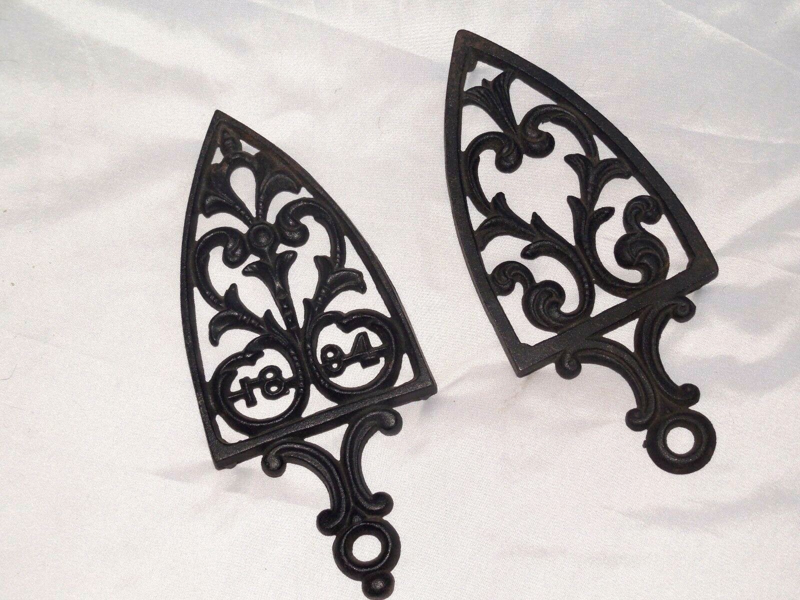 TWO PRE-OWNED BLACK CAST IRON  KITCHEN TRIVETS