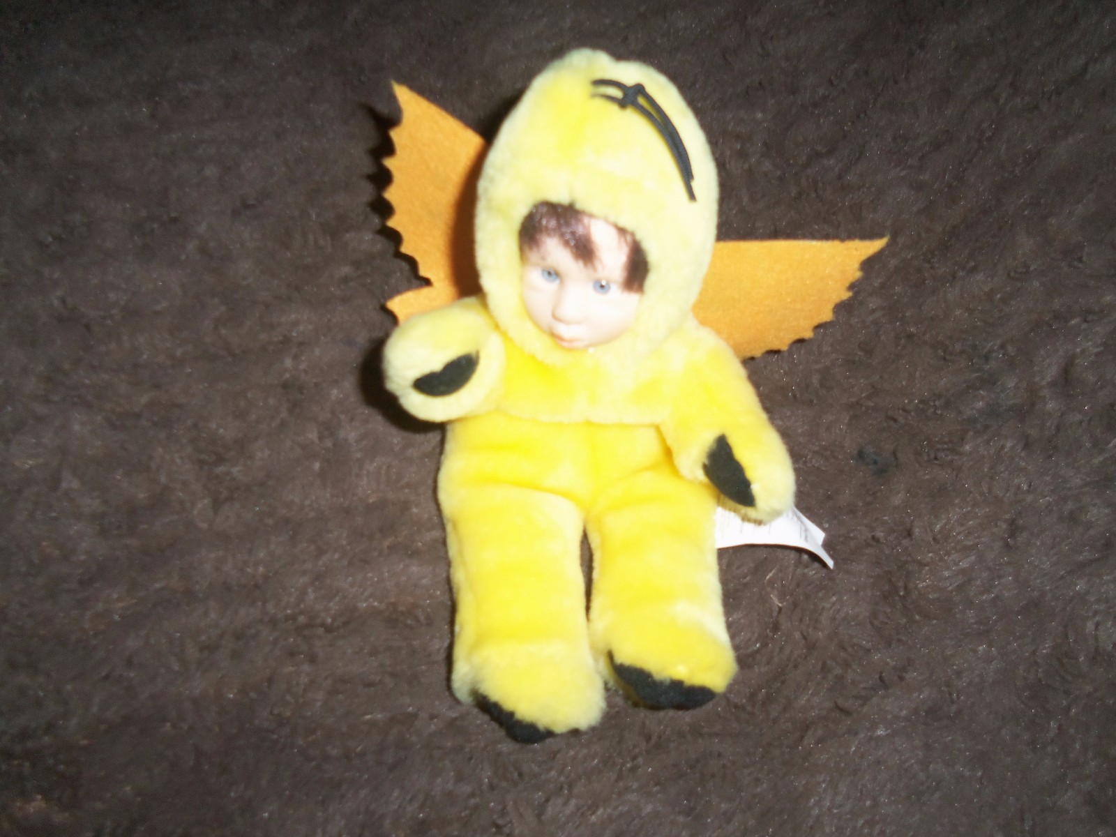 Brown Squirrel Anne Geddes     Yellow doll with wings  -- no name of company