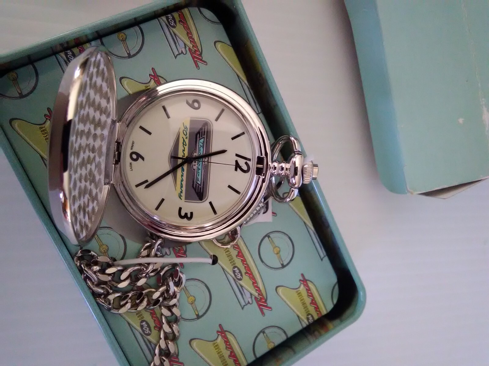 Ford Thunderbird collectible pocket watch and tin.
