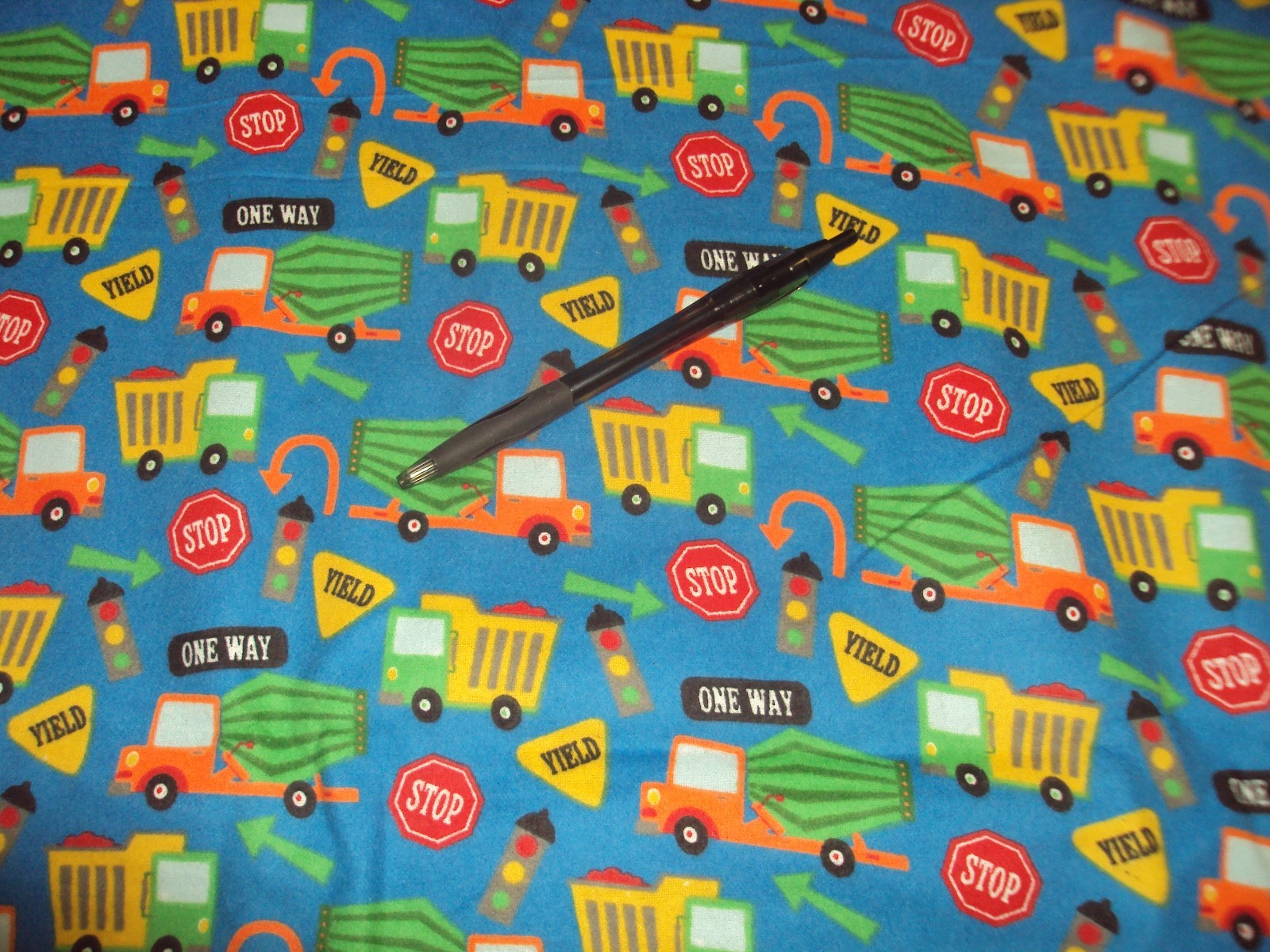 Blue cotton flannel fabric with trucks and road signs, boy, 1 yard