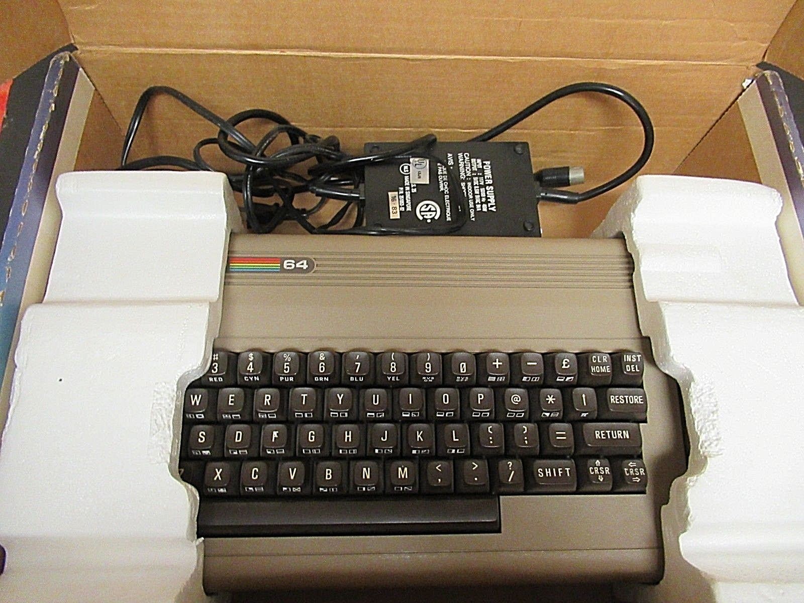 COMMODORE 64 WITH ORIGINAL BOX, POWER CORD, 11 FLOPPY DISKS, DISK DRIVE CLEANER