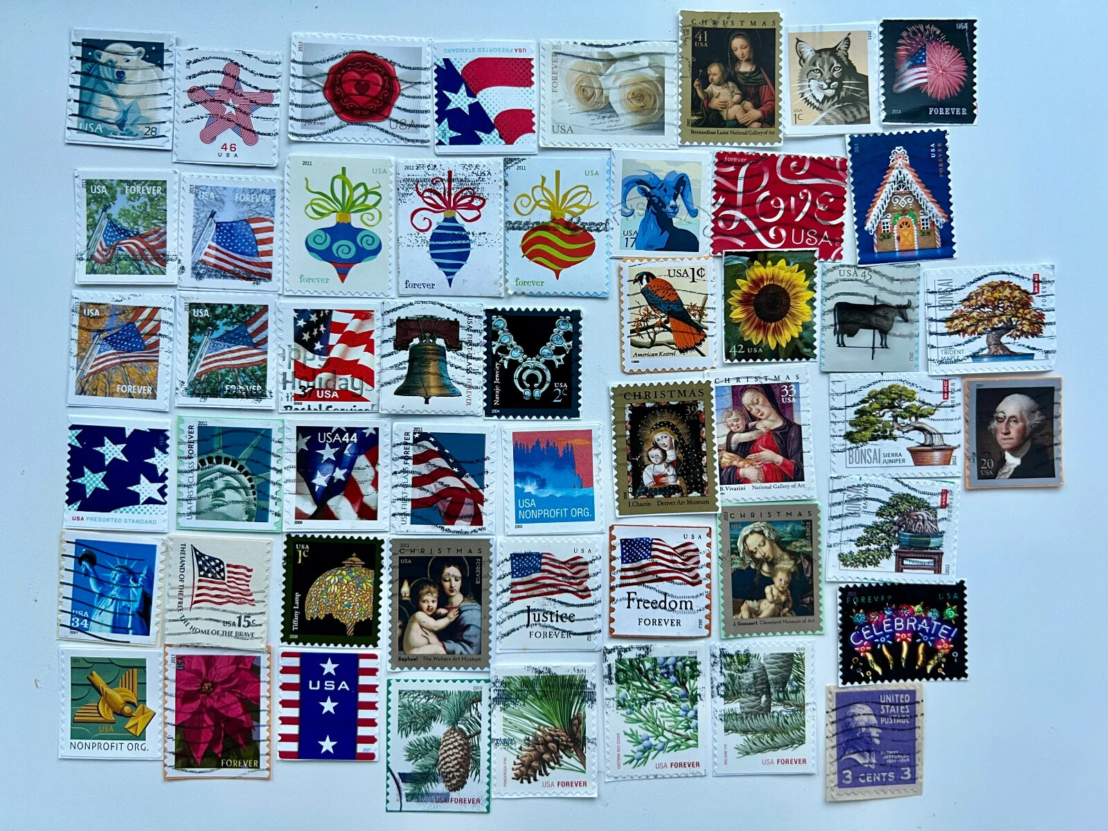 50 US Postage Stamps ON PAPER - Most are Forever - all canceled