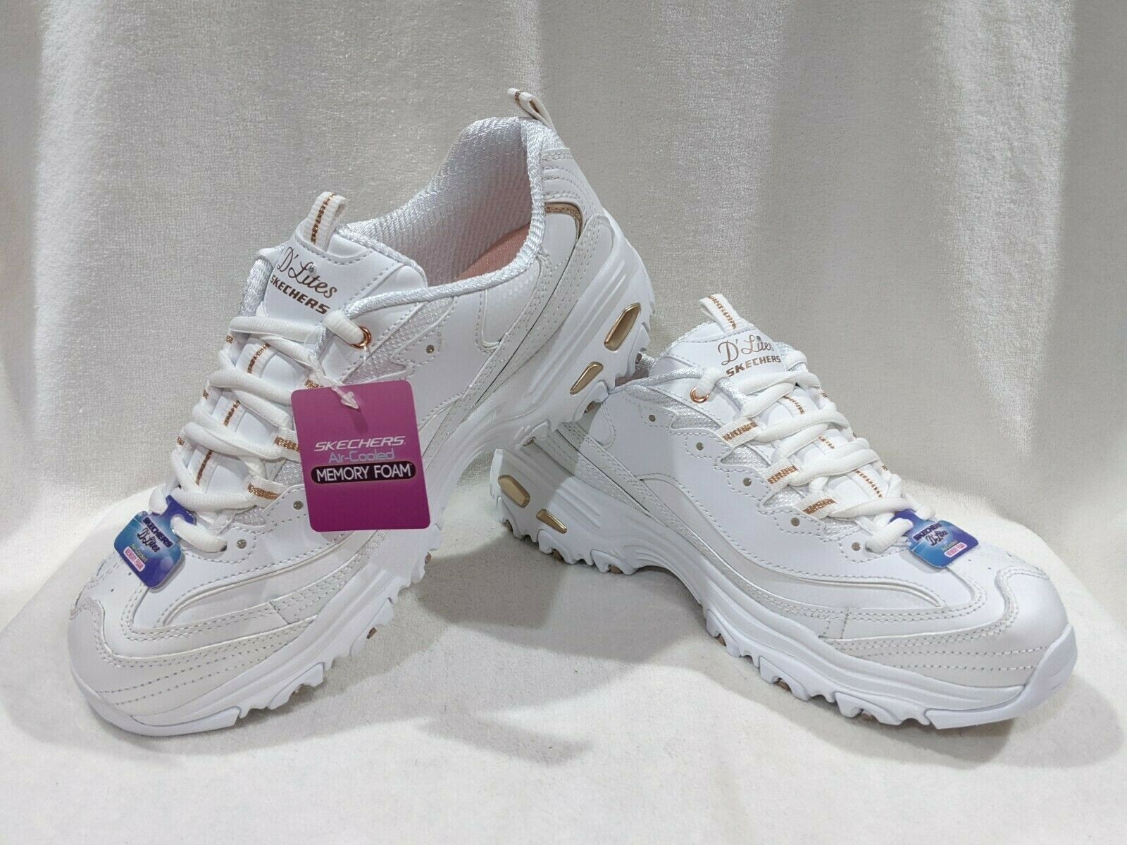white and rose gold skechers
