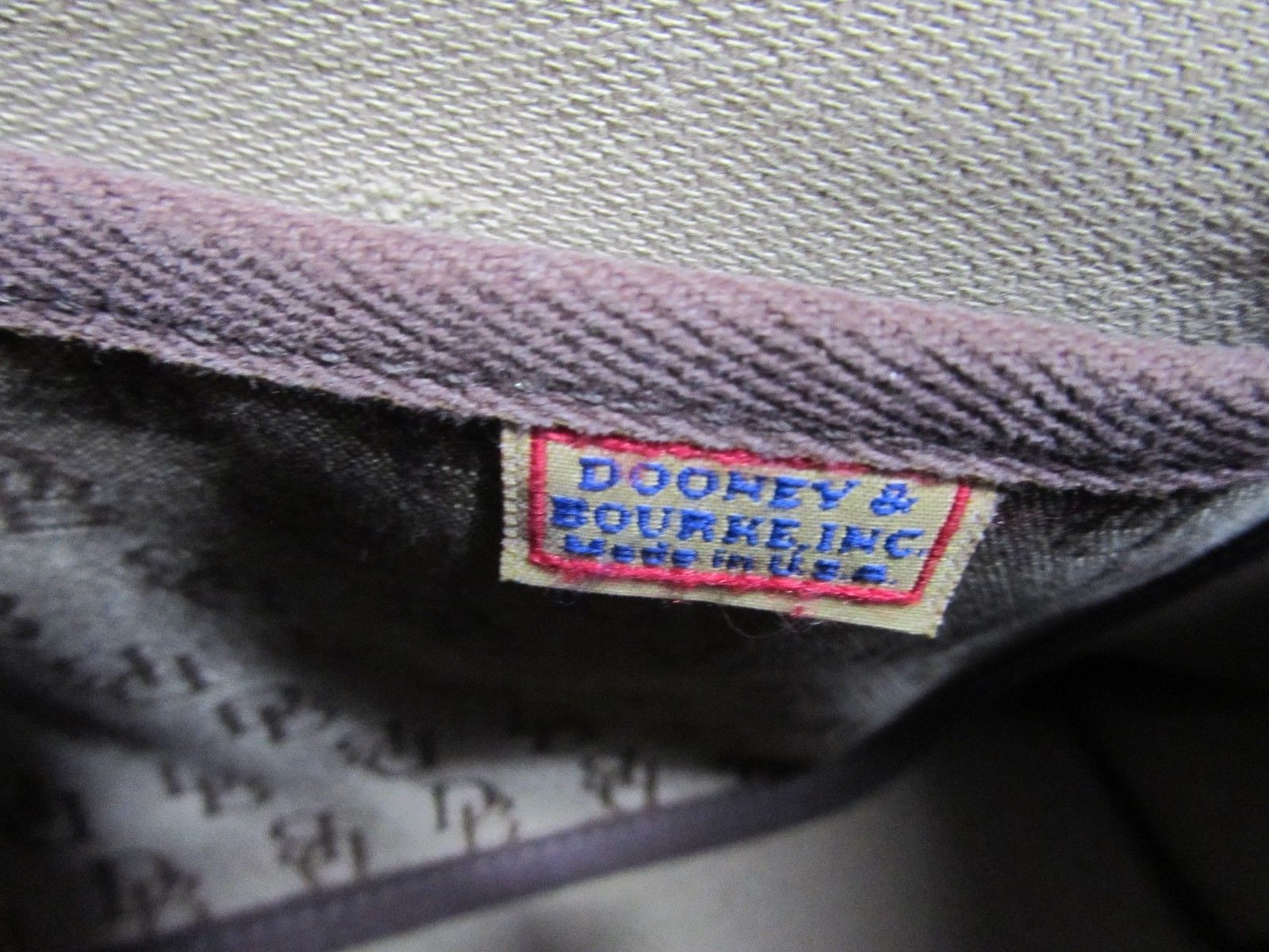 Authentic Dooney & Bourke Brown Monogram Tassel Top Zip Satchel Purse Bag