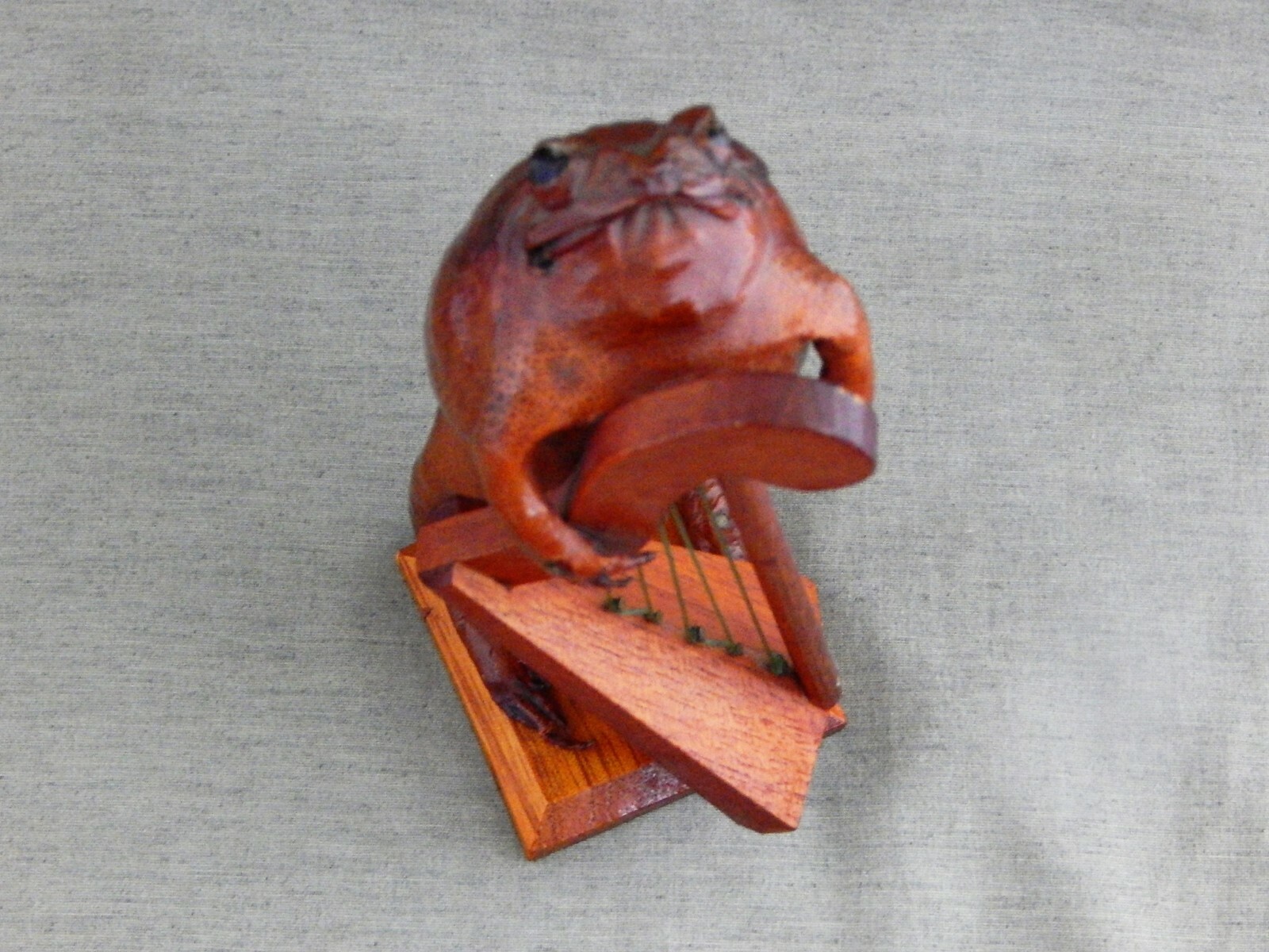 6 1/2 INCH PRESERVED FROG PLAYING A HARP.GREAT CONDITION.