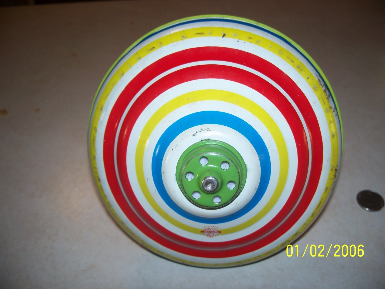 Vintage Ohio Art Co. -- Tin Spinning Top  here we go round the mulberry bush
