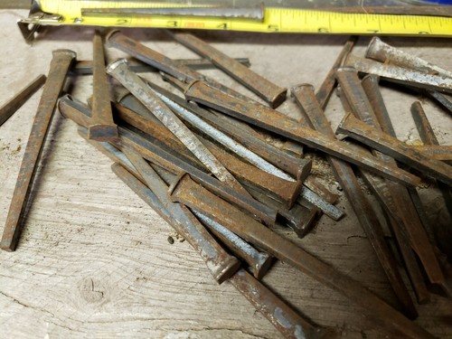 63 Antique 3 1/2 inch, square cut nails hand made unused, straight but rusty.