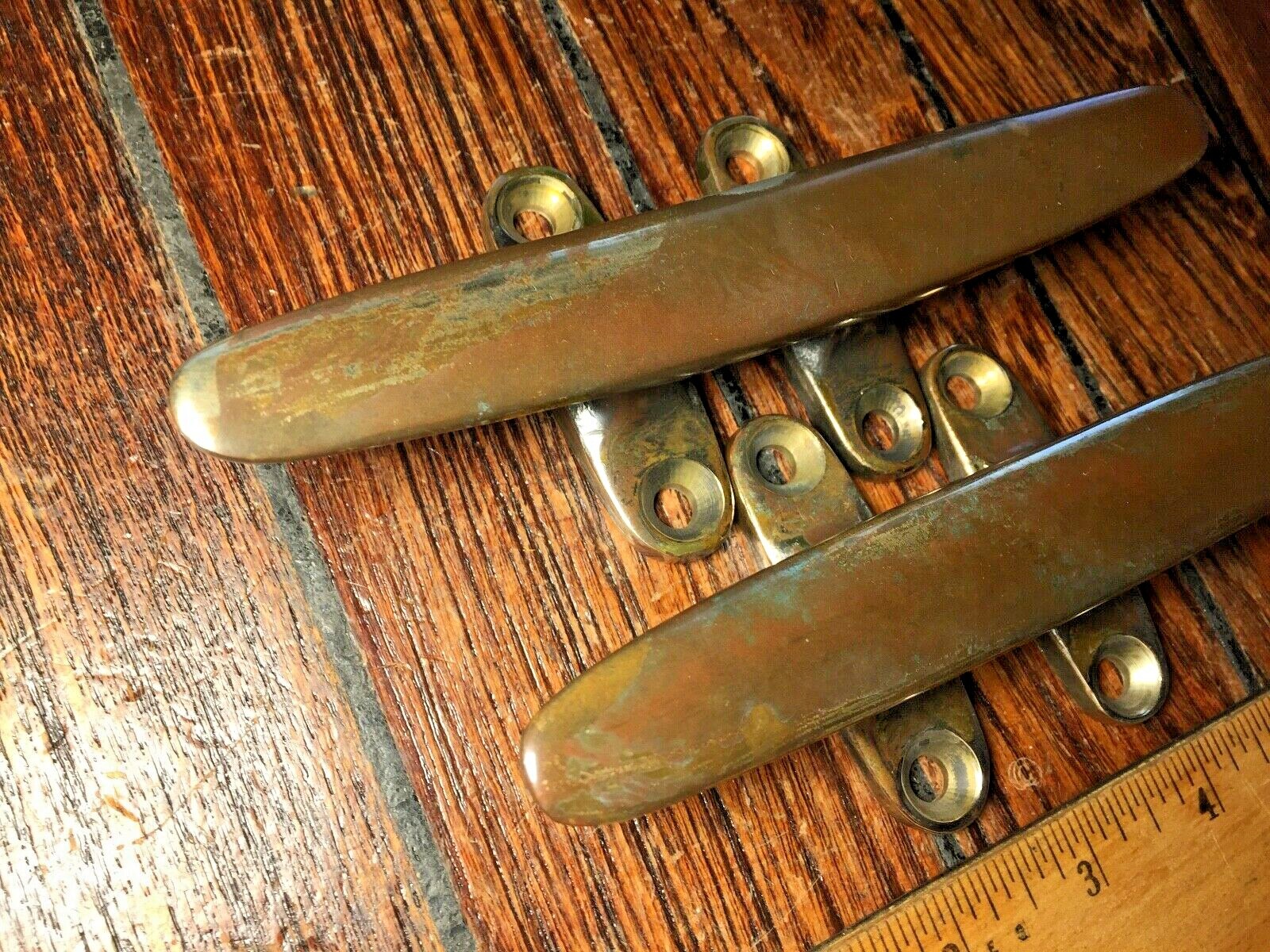 PAIR OF VINTAGE SOLID BRONZE CLEATS 6