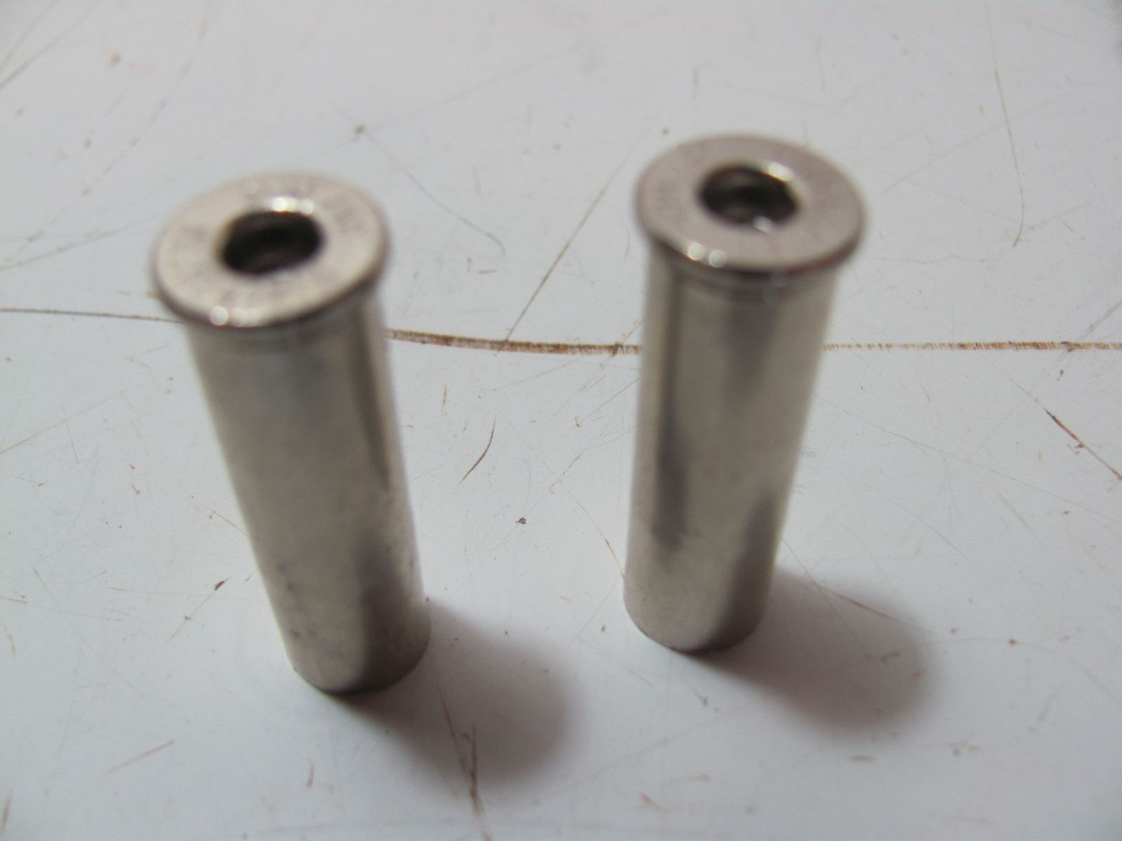 VINTAGE PAIR OF SHELL CASING VALVE CAPS