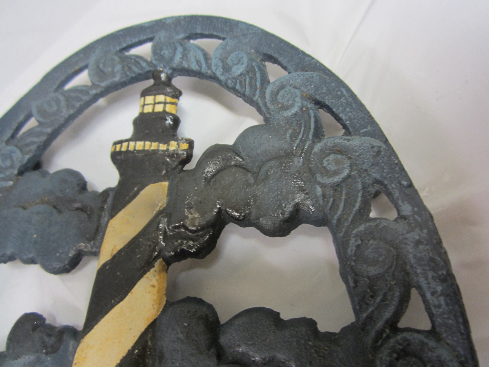 Vintage cast iron lighthouse trivet  9X7