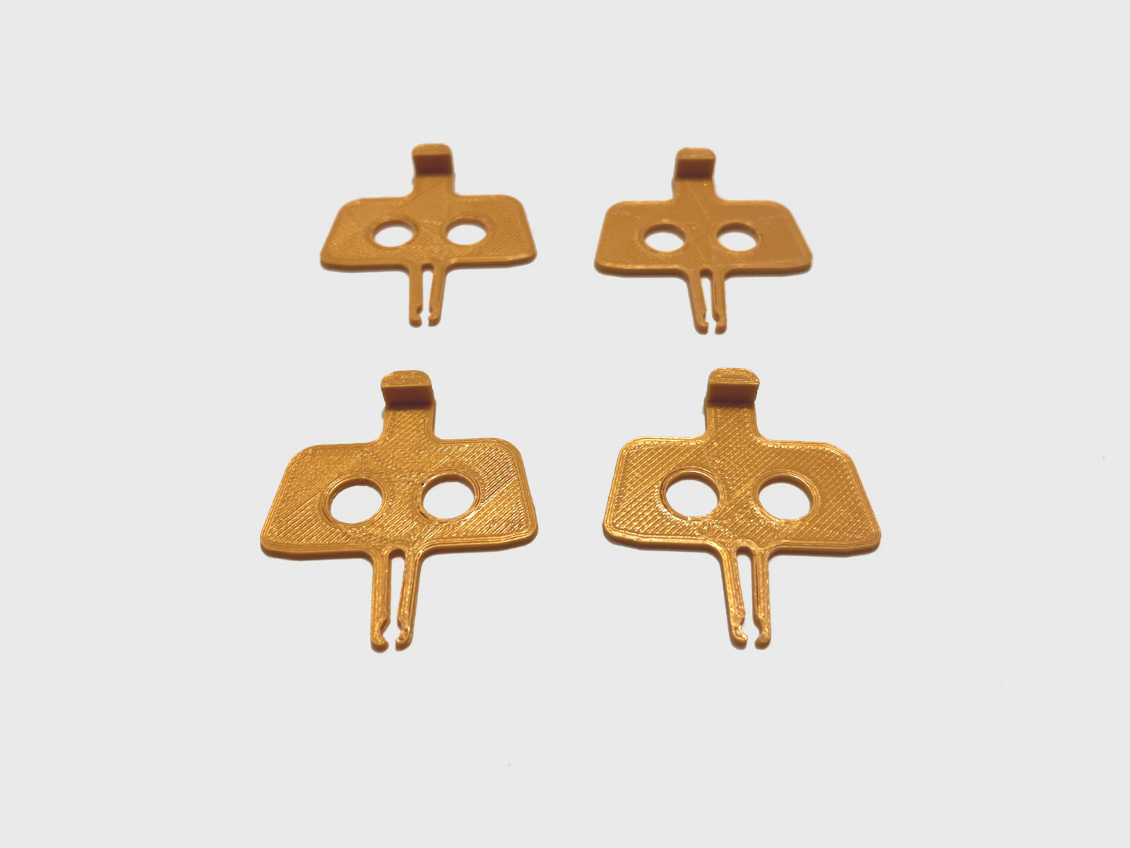 Bicycle hydraulic disc brake spacer, plastic, gold colored, pack of 4