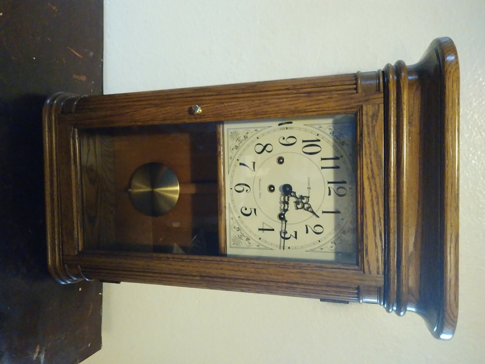 Howard Miller Sandringham Wall Clock 24 x 14 Oak Case 613108