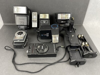 Lot of Camera Parts and Accessories - Flashes, Grip, Meters