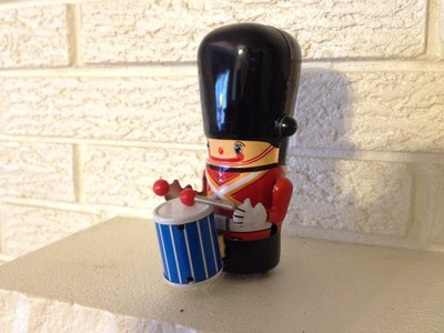 wind up tin litho toy soldier he plays his drum while marching