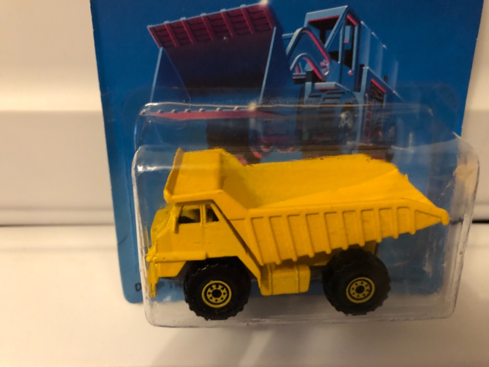 Vintage hot wheels cat dump truck on Un punched  card