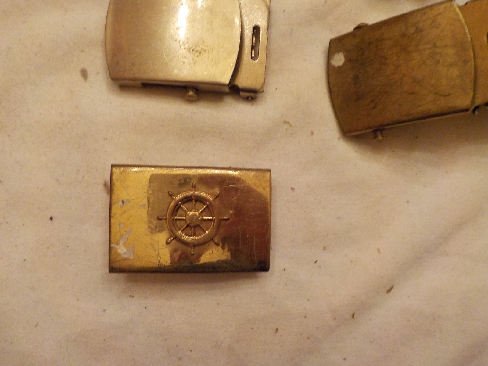 LOT OF ASSORTED MILITARY BELT BUCKLES AND  ONE BELT