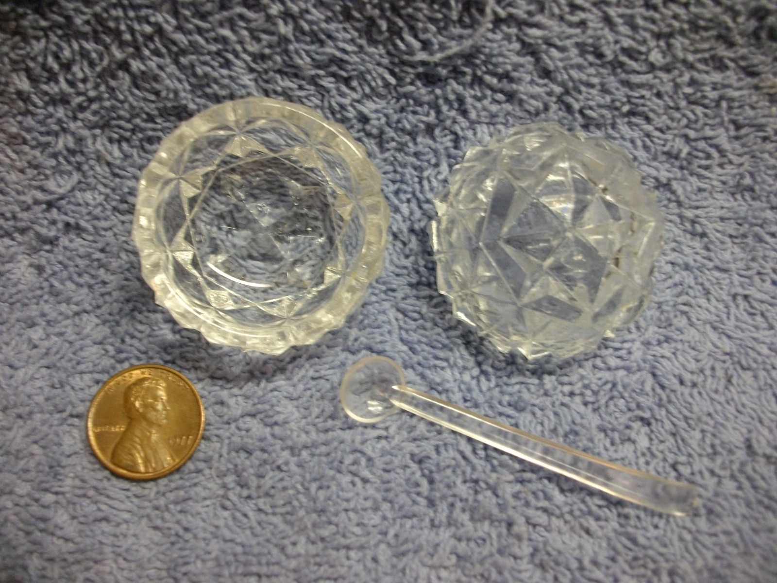 (2) CLEAR PRESSED GLASS SALT CELLARS WITH ONE SPOON