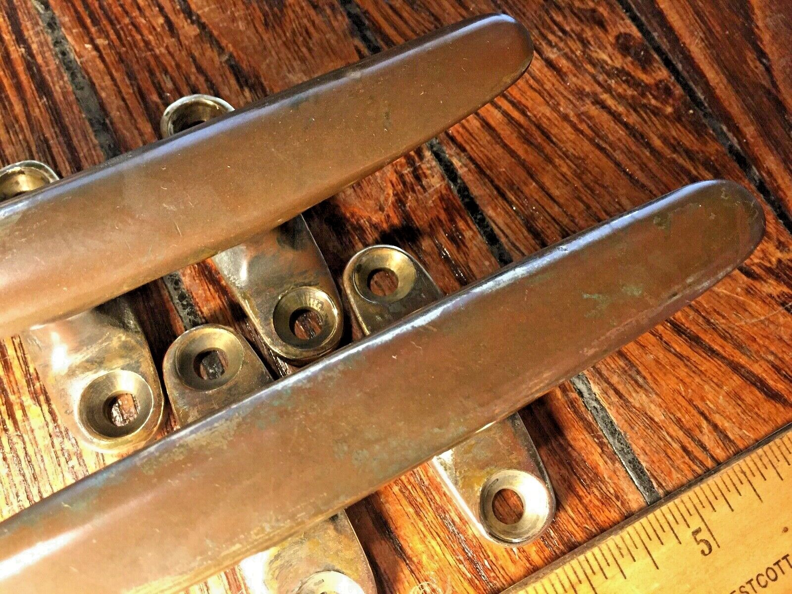 PAIR OF VINTAGE SOLID BRONZE CLEATS 6