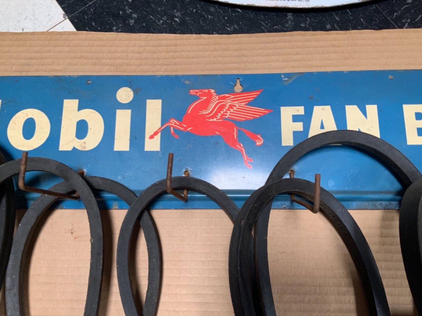 Original Mobil Fan Belt Display Rack with original belts and packaging