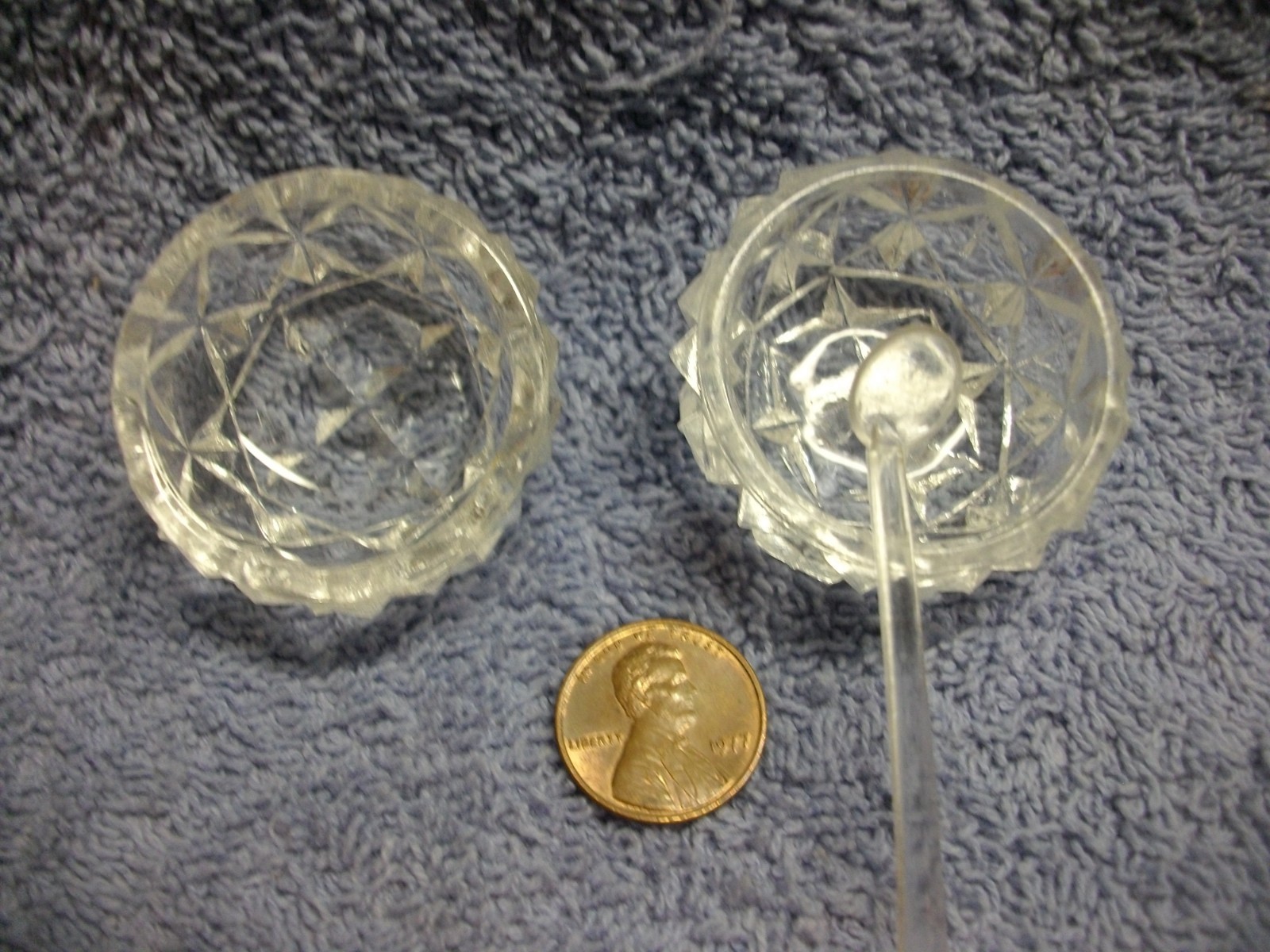 (2) CLEAR PRESSED GLASS SALT CELLARS WITH ONE SPOON